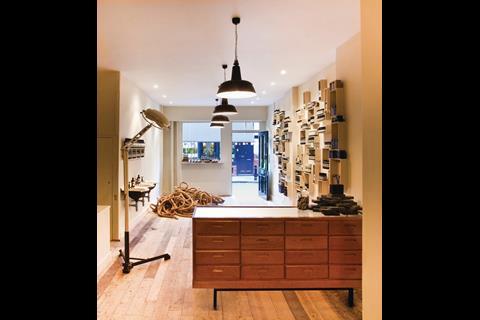 Aesop’s London Bridge store has a low-key wooden frontage, with a somewhat severe interior. Untreated and stripped wooden boards and overhead pendant lights complete the effect